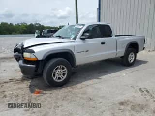 2002 Dodge Dakota z VIN 1B7GG12X92S697122, wystawiony jako Copart lot #56000975 z przebiegiem 151 012 mil mil oraz Szkoda całkowita • Salvage title. Historia ofert i sprzedaży dostępna na DreamBid. Obrazek 1.