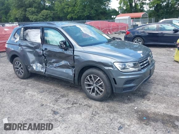 ✅ 2021 Volkswagen Tiguan S • VIN: 3VV1B7AX5MM148491 • Lot: 42561437. Listed on IAAI with 54,084 mi. Free auction sales archive from the USA and detailed vehicle history report at DreamBid. Image 1.
