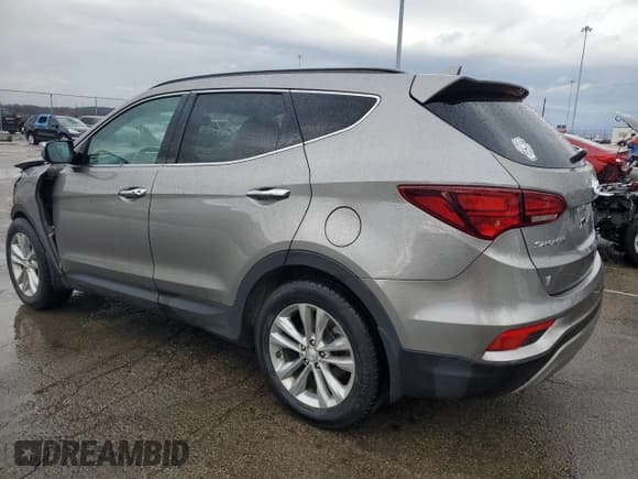 ✅ 2018 Hyundai Santa Fe Limited • VIN: 5XYZUDLA7JG512731 • Лот: 84942364. Опубликован ранее на Copart с пробегом 79 192 миль. Бесплатный доступ к архиву аукционных продаж из США и подробный отчёт об истории автомобиля на DreamBid. Изображение 2.