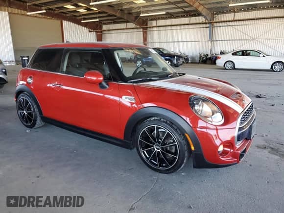 2014 MINI Hardtop S with VIN WMWXM7C56ET988018, listed as a Copart auction lot 64136785 with 73,870 mi miles and Salvage title. Bid and sale history available at DreamBid. Image 4.