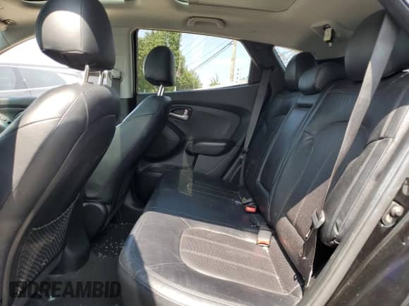 2012 Hyundai Tucson GLS z VIN KM8JU3AC5CU344709, wystawiony jako Copart lot #68502204 z przebiegiem 148 356 mil mil oraz Szkoda całkowita • Salvage title. Historia ofert i sprzedaży dostępna na DreamBid. Obrazek 11.