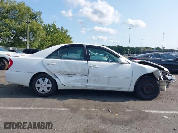 ✅ 2002 Toyota Camry LE • VIN: 4T1BE32K62U063797 • Lot: 43176367. Listed on IAAI with 209,320 mi. Free auction sales archive from the USA and detailed vehicle history report at DreamBid. Image 13.