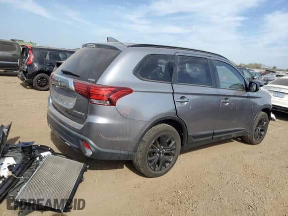 2018 Mitsubishi Outlander ES z VIN JA4AZ3A3XJZ023782, wystawiony jako Copart lot #84819265 z przebiegiem 64 823 mil mil oraz Szkoda całkowita • Salvage title. Historia ofert i sprzedaży dostępna na DreamBid. Obrazek 3.