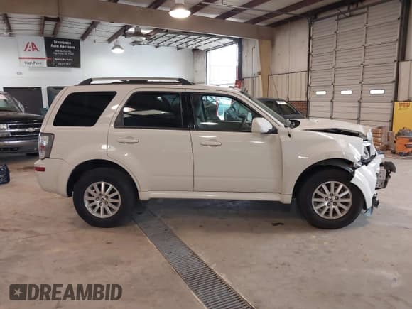 ✅ 2010 Mercury Mariner Premier • VIN: 4M2CN8HGXAKJ00279 • Lot: 41748487. Listed on IAAI with 116,565 mi. Free auction sales archive from the USA and detailed vehicle history report at DreamBid. Image 13.