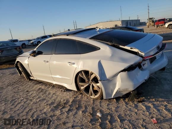 ✅ 2021 Audi RS 7 • VIN: WUAPCBF29MN900742 • Lot: 83706664. Wystawiony na Copart z przebiegiem 48 227 mil. Bezpłatny archiwum sprzedaży aukcyjnych z USA i szczegółowy raport historii pojazdu na DreamBid. Zdjęcie 2.