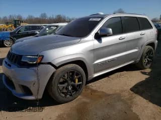 ✅ 2018 Jeep Grand Cherokee • VIN: NJ1454E • Lot: 48051693. Listed on Copart with 66,894 mi. Free auction sales archive from the USA and detailed vehicle history report at DreamBid. Image 1.