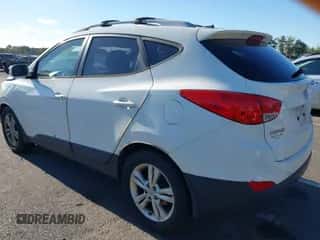 2012 Hyundai Tucson Limited z VIN KM8JUCAC1CU336154, wystawiony jako IAAI lot #43344870 z przebiegiem 197 821 mil mil oraz . Historia ofert i sprzedaży dostępna na DreamBid. Obrazek 3.