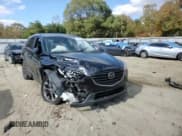 ✅ 2016 Mazda CX-5 Grand Touring • VIN: JM3KE4DY9G0764433 • Lot: 82728825. Wystawiony na Copart z przebiegiem 166 905 mil. Bezpłatny archiwum sprzedaży aukcyjnych z USA i szczegółowy raport historii pojazdu na DreamBid. Zdjęcie 14.