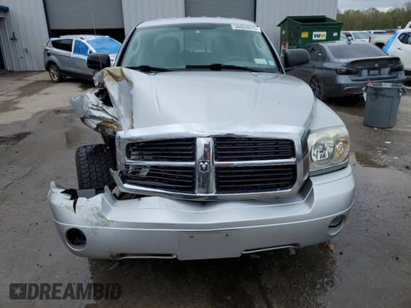 2005 Dodge Dakota Laramie with VIN 1D7HW58N95S200293, listed as a Copart auction lot 56053075 with 104,769 mi miles and Salvage title. Bid and sale history available at DreamBid. Image 5.
