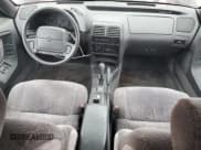 ✅ 1995 Chrysler LeBaron GTC • VIN: 1C3EU4531SF597149 • Lot: 59540185. Wystawiony na Copart z przebiegiem 79 932 mil. Bezpłatny archiwum sprzedaży aukcyjnych z USA i szczegółowy raport historii pojazdu na DreamBid. Zdjęcie 8.