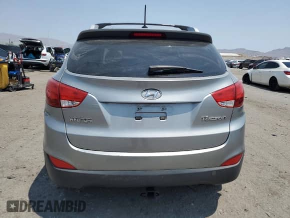 2013 Hyundai Tucson GLS z VIN KM8JU3AC9DU713671, wystawiony jako Copart lot #64999045 z przebiegiem 69 751 mil mil oraz Szkoda całkowita • Salvage title. Historia ofert i sprzedaży dostępna na DreamBid. Obrazek 6.