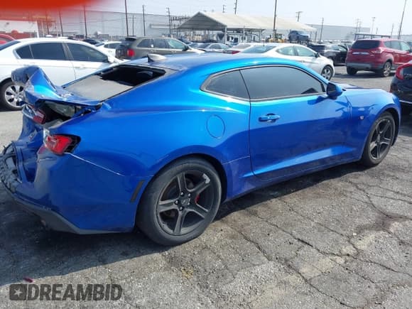 ✅ 2018 Chevrolet Camaro 1LT • VIN: 1G1FB1RS7J0146601 • Lot: 43002365. Listed on IAAI with 98,021 mi. Free auction sales archive from the USA and detailed vehicle history report at DreamBid. Image 4.