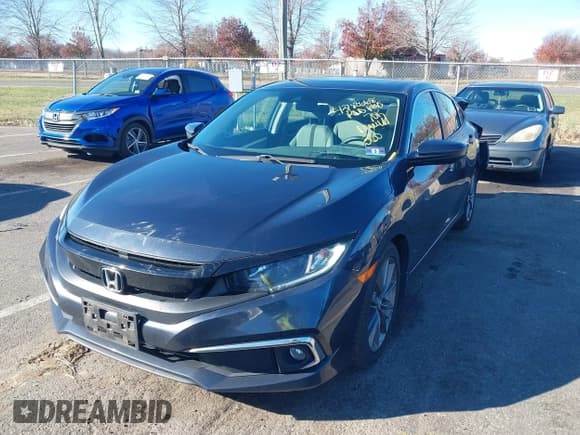 ✅ 2019 Honda Civic EX • VIN: 19XFC1F34KE204349 • Lot: 43780668. Listed on IAAI with 70,089 mi. Free auction sales archive from the USA and detailed vehicle history report at DreamBid. Image 2.