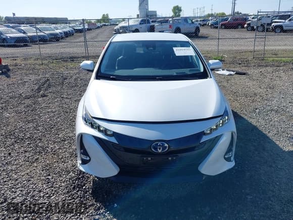 ✅ 2022 Toyota Prius LE • VIN: JTDKAMFP8N3198379 • Lot: 42094943. Listed on IAAI with 14,428 mi. Free auction sales archive from the USA and detailed vehicle history report at DreamBid. Image 12.
