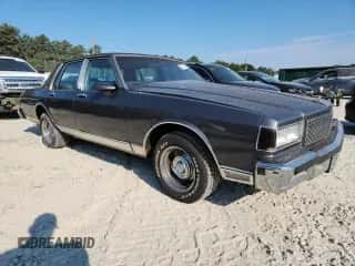1985 Chevrolet Caprice z VIN 1G1BN69H6FY135833, wystawiony jako Copart lot #80281155 z przebiegiem 2 381 mil mil oraz Szkoda całkowita • Salvage title. Historia ofert i sprzedaży dostępna na DreamBid. Obrazek 4.