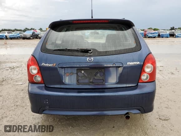 ✅ 2003 Mazda Protege • VIN: JM1BJ245931128629 • Lot: 81700205. Listed on Copart with 107,189 mi. Free auction sales archive from the USA and detailed vehicle history report at DreamBid. Image 6.
