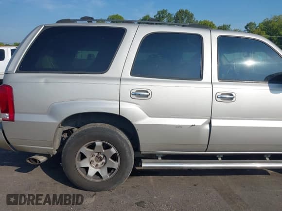 ✅ 2004 Cadillac Escalade • VIN: 1GYEK63N14R200973 • Lot: 42926800. Listed on IAAI with 261,068 mi. Free auction sales archive from the USA and detailed vehicle history report at DreamBid. Image 6.