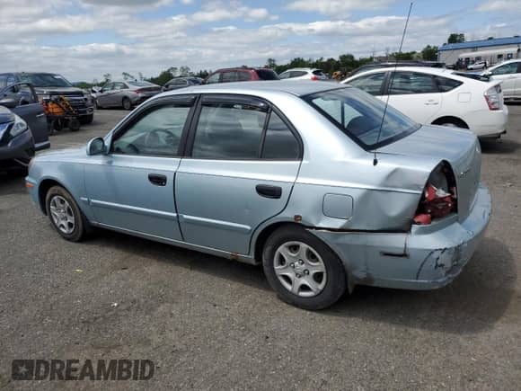 2004 Hyundai Accent GL z VIN KMHCG45C94U574027, wystawiony jako Copart lot #57463905 z przebiegiem 139 595 mil mil oraz Szkoda całkowita • Salvage title. Historia ofert i sprzedaży dostępna na DreamBid. Obrazek 2.