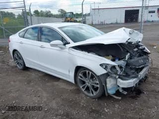 ✅ 2020 Ford Fusion Titanium • VIN: 3FA6P0D95LR138772 • Lot: 42363326. Listed on IAAI with 103,393 mi. Free auction sales archive from the USA and detailed vehicle history report at DreamBid. Image 1.