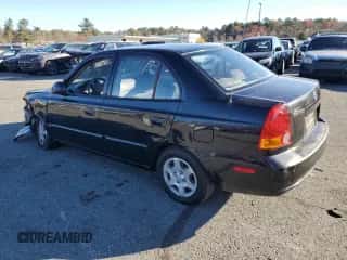 2005 Hyundai Accent GLS with VIN KMHCG45C15U662362, listed as a Copart auction lot 80574774 with 122,898 mi miles and Salvage title. Bid and sale history available at DreamBid. Image 2.