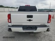 ✅ 2016 Chevrolet Silverado 1500 High Country • VIN: 3GCPCTEC5GG181483 • Lot: 59668255. Wystawiony na Copart z przebiegiem 143 215 mil. Bezpłatny archiwum sprzedaży aukcyjnych z USA i szczegółowy raport historii pojazdu na DreamBid. Zdjęcie 6.