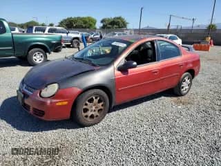 2004 Dodge Neon SXT with VIN 1B3ES56C14D505687, listed as a Copart auction lot 84958115 with 211,385 mi miles and Salvage title. Bid and sale history available at DreamBid. Image 1.