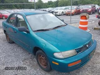 ✅ 1995 Mazda Protege • VIN: JM1BA1415S0181226 • Lot: 42895724. Wystawiony na IAAI z przebiegiem 163 258 mil. Bezpłatny archiwum sprzedaży aukcyjnych z USA i szczegółowy raport historii pojazdu na DreamBid. Zdjęcie 1.