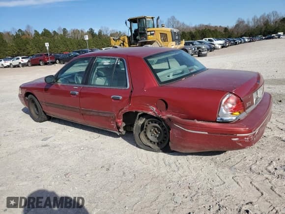 ✅ 2001 Ford Crown Victoria • VIN: 2FAFP73W51X102000 • Lot: 83523364. Listed on Copart with 202,320 mi. Free auction sales archive from the USA and detailed vehicle history report at DreamBid. Image 2.