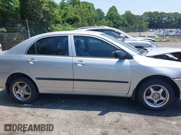 ✅ 2005 Toyota Corolla CE • VIN: JTDBR32E250055971 • Lot: 42660536. Listed on IAAI with 299,999 mi. Free auction sales archive from the USA and detailed vehicle history report at DreamBid. Image 13.