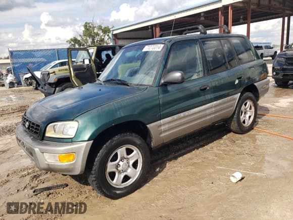 ✅ 2000 Toyota RAV4 • VIN: JT3GP10V1Y0042107 • Lot: 71273314. Listed on Copart with 221,369 mi. Free auction sales archive from the USA and detailed vehicle history report at DreamBid. Image 1.