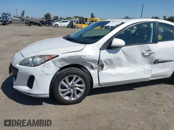 ✅ 2013 Mazda 3 i Grand Touring • VIN: JM1BL1WPXD1800976 • Lot: 43121977. Listed on IAAI with 77,671 mi. Free auction sales archive from the USA and detailed vehicle history report at DreamBid. Image 6.