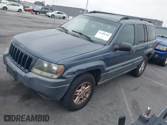 ✅ 2004 Jeep Grand Cherokee Laredo • VIN: 1J4GW48S74C223970 • Lot: 42408360. Listed on IAAI with 238,099 mi. Free auction sales archive from the USA and detailed vehicle history report at DreamBid. Image 2.