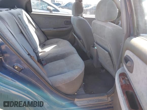 ✅ 2004 Kia Optima LX • VIN: KNAGD128645306685 • Лот: 41488256. Опубликован ранее на IAAI с пробегом 216 974 миль. Бесплатный доступ к архиву аукционных продаж из США и подробный отчёт об истории автомобиля на DreamBid. Изображение 8.