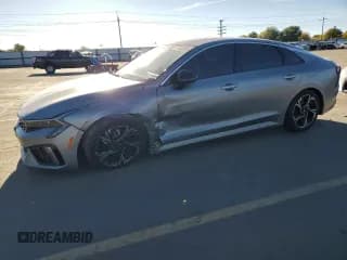 ✅ 2025 Kia K5 GT-Line • VIN: KNAG64J75S5291369 • Лот: 87440585. Опубликован ранее на Copart с пробегом 19 241 миль. Бесплатный доступ к архиву аукционных продаж из США и подробный отчёт об истории автомобиля на DreamBid. Изображение 1.