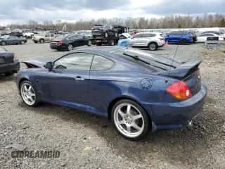 2004 Hyundai Tiburon GT с VIN KMHHN65F14U109145, выставлен на аукционе Copart как лот 51117385 с пробегом Не указан миль и Списание • Salvage title. История ставок и продаж доступна на DreamBid. Изображение 2.