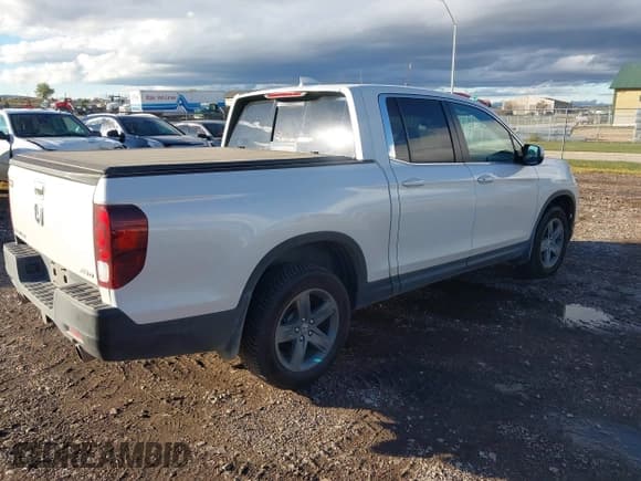 ✅ 2022 Honda Ridgeline RTL • VIN: 5FPYK3F50NB025921 • Lot: 43483259. Listed on IAAI with 45,266 mi. Free auction sales archive from the USA and detailed vehicle history report at DreamBid. Image 4.