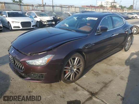 ✅ 2018 Maserati Ghibli • VIN: ZAM57XSA0J1286682 • Лот: 65457315. Опубликован ранее на Copart с пробегом 50 169 миль. Бесплатный доступ к архиву аукционных продаж из США и подробный отчёт об истории автомобиля на DreamBid. Изображение 1.