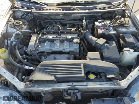 ✅ 2002 Mazda Protege DX • VIN: JM1BJ225921589573 • Lot: 82300865. Wystawiony na Copart z przebiegiem 108 594 mil. Bezpłatny archiwum sprzedaży aukcyjnych z USA i szczegółowy raport historii pojazdu na DreamBid. Zdjęcie 11.