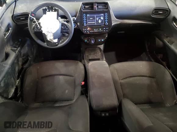 2021 Toyota Prius L Eco с VIN JTDKAMFU5M3143781, выставлен на аукционе Copart как лот 81028565 с пробегом 52 355 миль миль и Списание • Salvage title. История ставок и продаж доступна на DreamBid. Изображение 8.