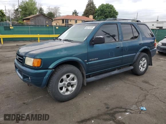 ✅ 1999 Isuzu Rodeo S • VIN: 4S2CM58W5X4313060 • Lot: 62211235. Wystawiony na Copart z przebiegiem 157 222 mil. Bezpłatny archiwum sprzedaży aukcyjnych z USA i szczegółowy raport historii pojazdu na DreamBid. Zdjęcie 1.