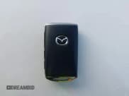 ✅ 2023 Mazda CX-50 Premium Plus • VIN: 7MMVABEY7PN115401 • Лот: 43575616. Опубликован ранее на IAAI с пробегом 50 387 миль. Бесплатный доступ к архиву аукционных продаж из США и подробный отчёт об истории автомобиля на DreamBid. Изображение 11.