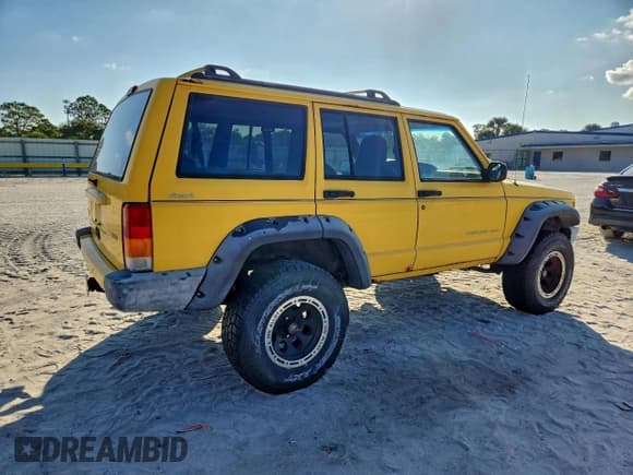 ✅ 2001 Jeep Cherokee Sport • VIN: 1J4FF48S61L585845 • Lot: 94385795. Listed on Copart with 110,014 mi. Free auction sales archive from the USA and detailed vehicle history report at DreamBid. Image 3.