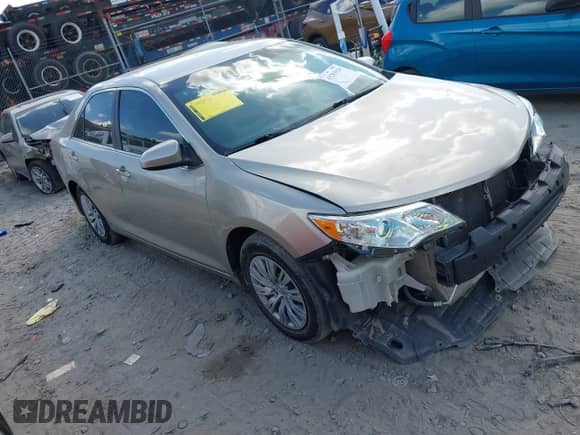 2014 Toyota Camry L with VIN 4T1BF1FK7EU776014, listed as a IAAI auction lot 43283920 with 151,081 mi miles and . Bid and sale history available at DreamBid. Image 1.
