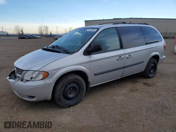 2006 Dodge Grand Caravan SE with VIN 1D4GP24R66B697589, listed as a Copart auction lot 90105685 with 303,817 mi miles and Salvage title. Bid and sale history available at DreamBid. Image 1.