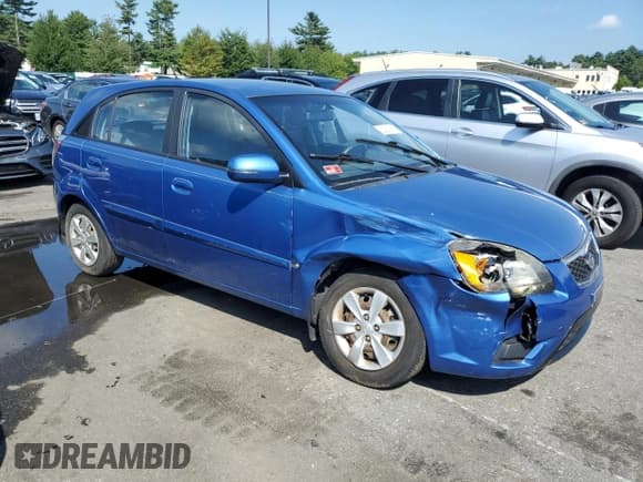 ✅ 2010 Kia Rio LX • VIN: KNADH5A37A6651217 • Lot: 65018164. Listed on Copart with 100,791 mi. Free auction sales archive from the USA and detailed vehicle history report at DreamBid. Image 4.