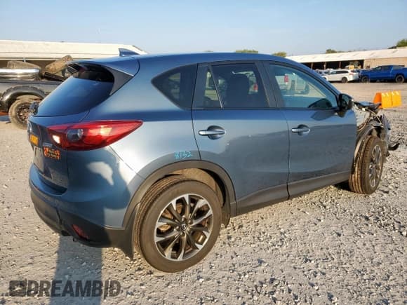 ✅ 2016 Mazda CX-5 Grand Touring • VIN: JM3KE2DY3G0703048 • Lot: 85378725. Wystawiony na Copart z przebiegiem 28 667 mil. Bezpłatny archiwum sprzedaży aukcyjnych z USA i szczegółowy raport historii pojazdu na DreamBid. Zdjęcie 3.