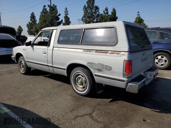 ✅ 1985 Nissan 720 • VIN: JN6ND01S5FW048770 • Лот: 85344525. Опубликован ранее на Copart с пробегом 27 667 миль. Бесплатный доступ к архиву аукционных продаж из США и подробный отчёт об истории автомобиля на DreamBid. Изображение 2.