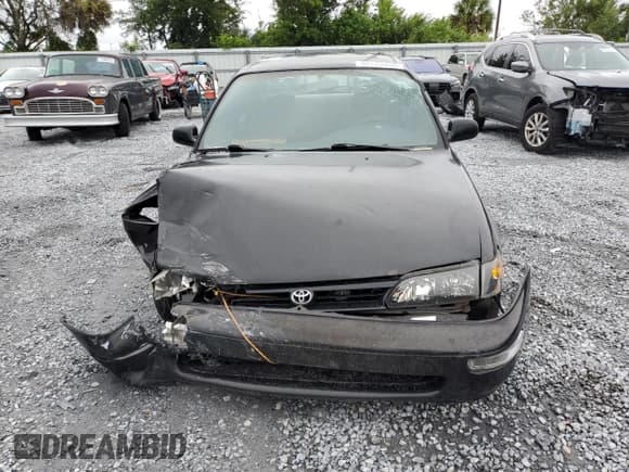 ✅ 1997 Toyota Corolla • VIN: 1NXBA02E3VZ535723 • Lot: 80125555. Wystawiony na Copart z przebiegiem 201 807 mil. Bezpłatny archiwum sprzedaży aukcyjnych z USA i szczegółowy raport historii pojazdu na DreamBid. Zdjęcie 5.