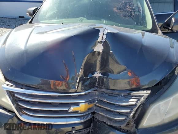 2014 Chevrolet Traverse LT z VIN 1GNKVGKD2EJ302949, wystawiony jako Copart lot #84380615 z przebiegiem Nie podano mil oraz Szkoda całkowita • Salvage title. Historia ofert i sprzedaży dostępna na DreamBid. Obrazek 12.