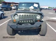 ✅ 2007 Jeep Wrangler Unlimited Sahara • VIN: 1J4GA59157L198095 • Lot: 43011519. Listed on IAAI with 198,022 mi. Free auction sales archive from the USA and detailed vehicle history report at DreamBid. Image 12.
